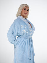 lady wearing alphabet robe made from cotton chenille lunar blue with white swirls